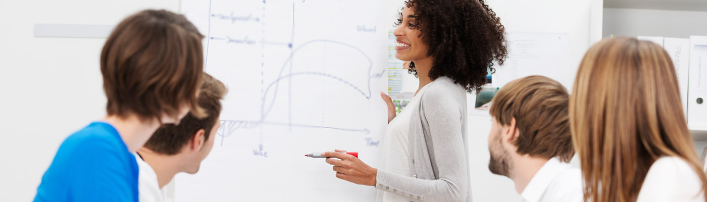 Woman giving a presentation to her colleagues